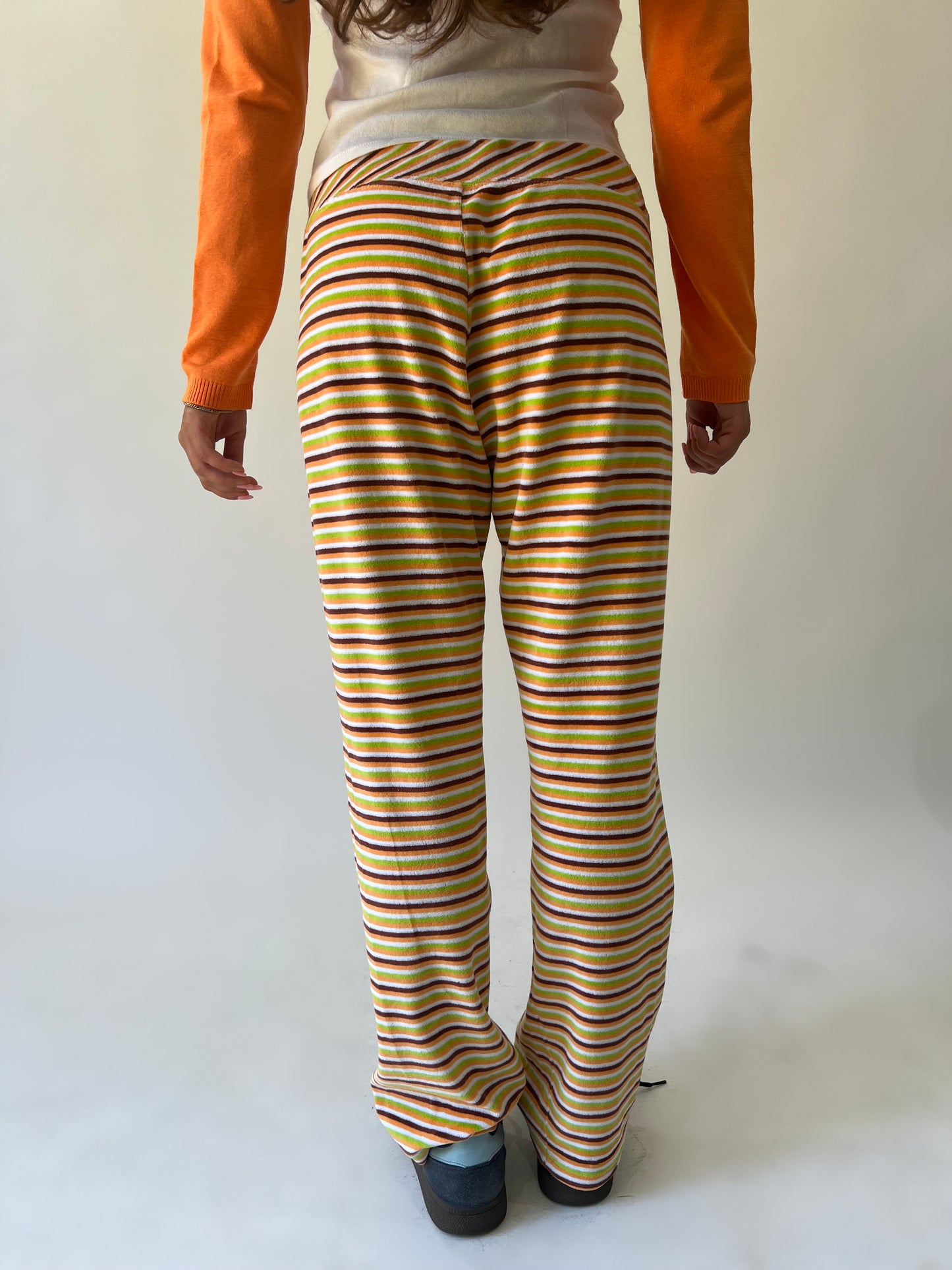 large multicoloured striped flared trousers back view