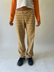 large multicoloured striped flared trousers close front view