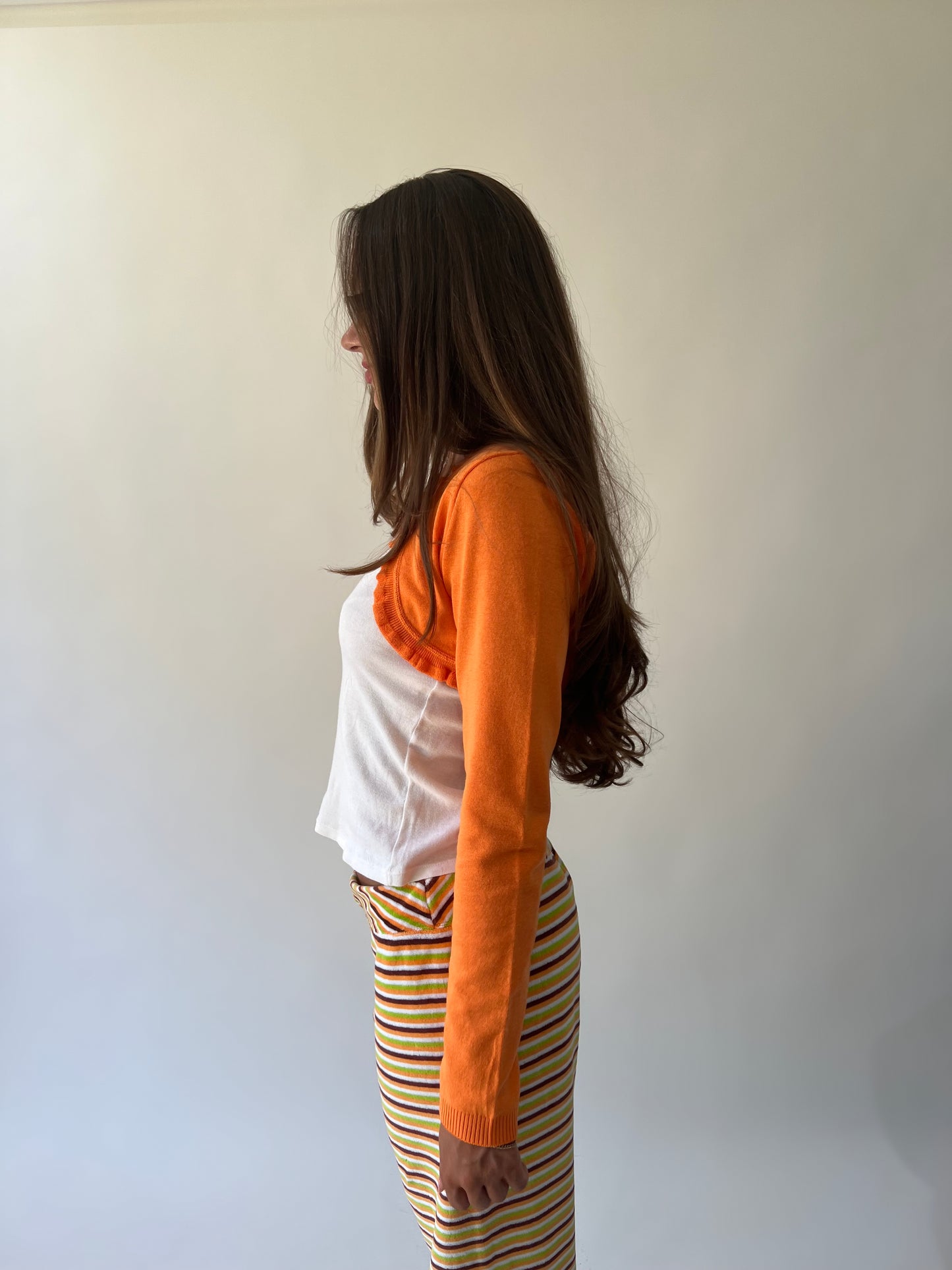 large multicoloured striped flared trousers side detail view