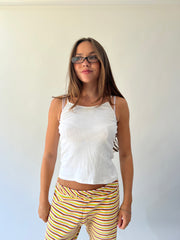 large multicoloured striped flared trousers close front view