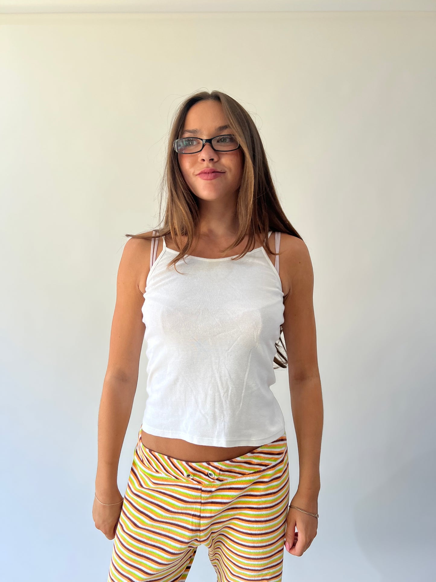 large multicoloured striped flared trousers close front view