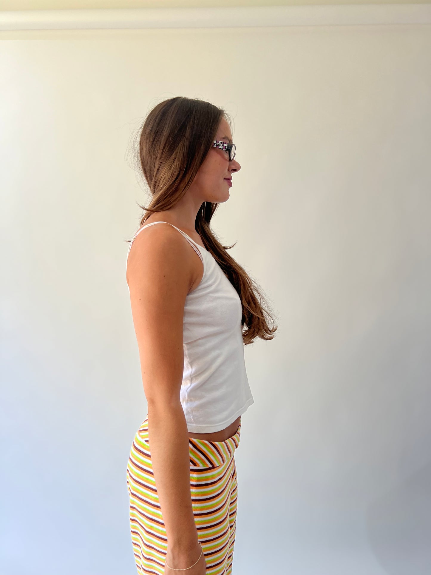 large multicoloured striped flared trousers alternate close side view