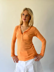 large orange ribbed button long sleeve top close front view