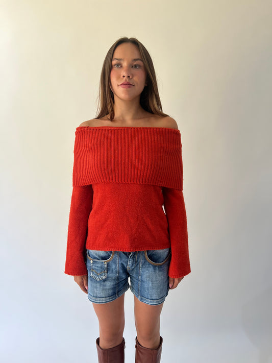 large orange off-shoulder ribbed sweater angled view