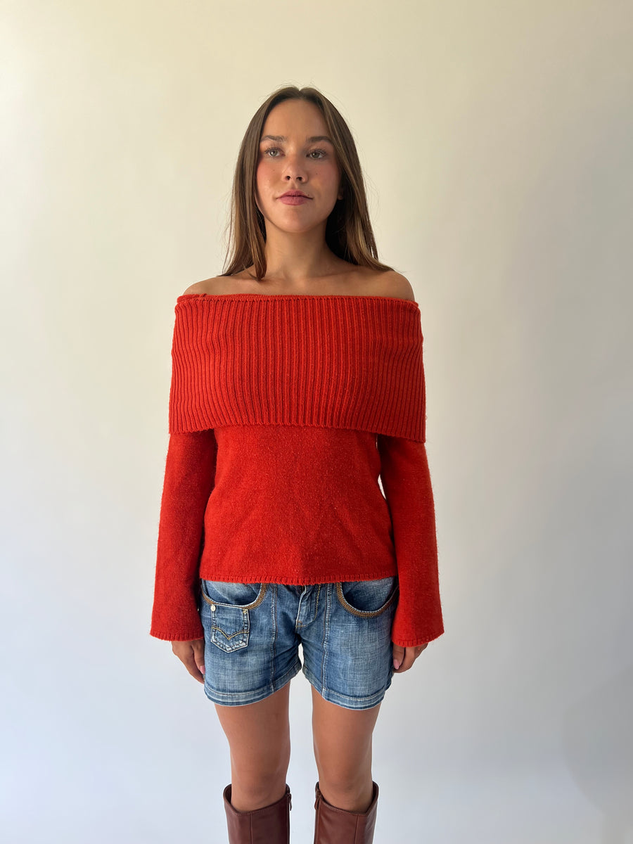 large orange off-shoulder ribbed sweater angled view
