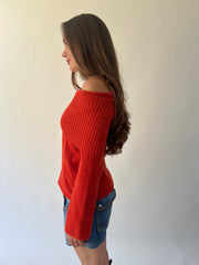 large orange off-shoulder ribbed sweater side view