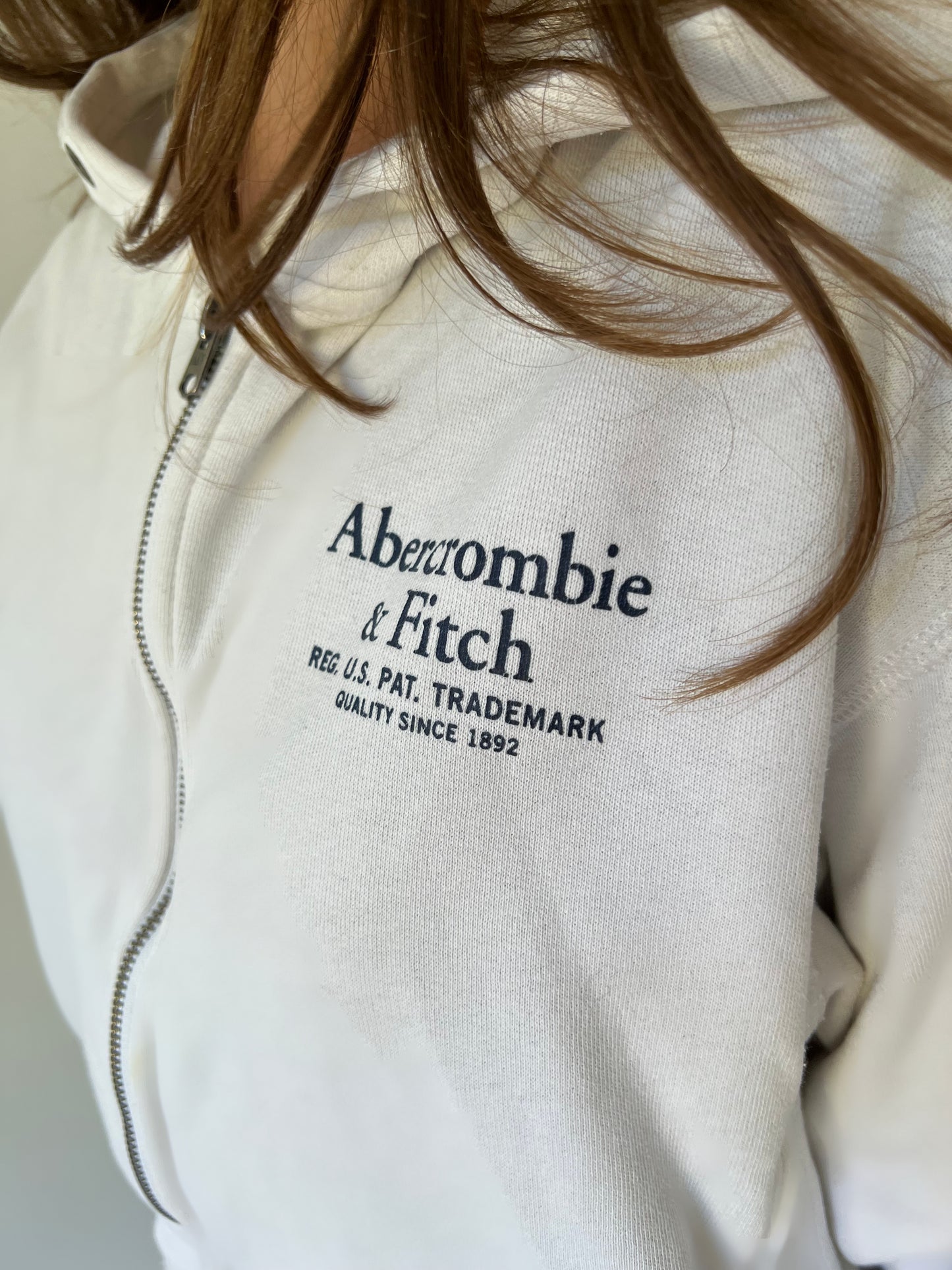 medium white abercrombie and fitch zip hoodie front logo detail