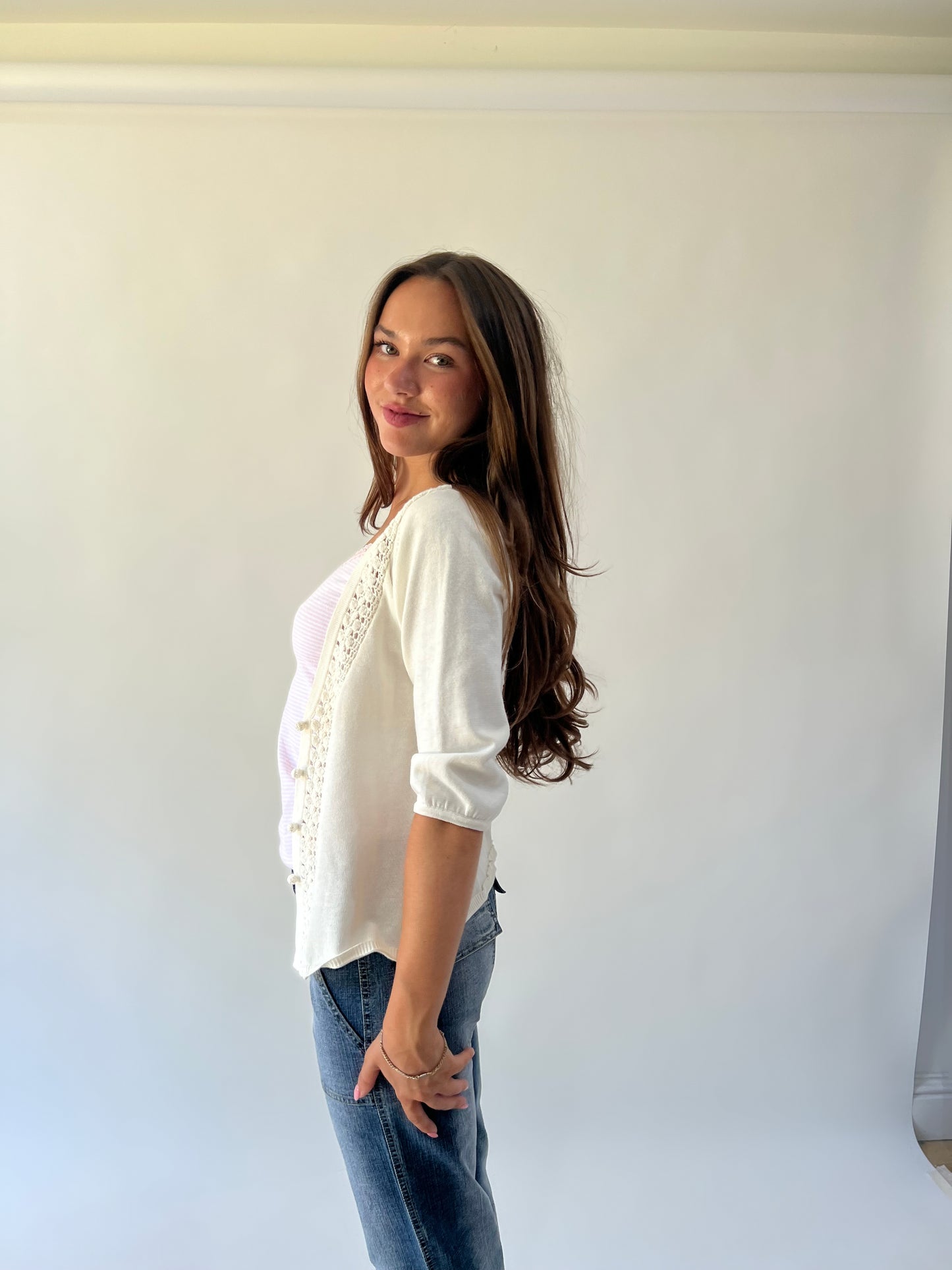 medium white crochet knit cardigan angled view
