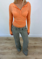 medium orange ribbed button long sleeve top aesthetic headless view