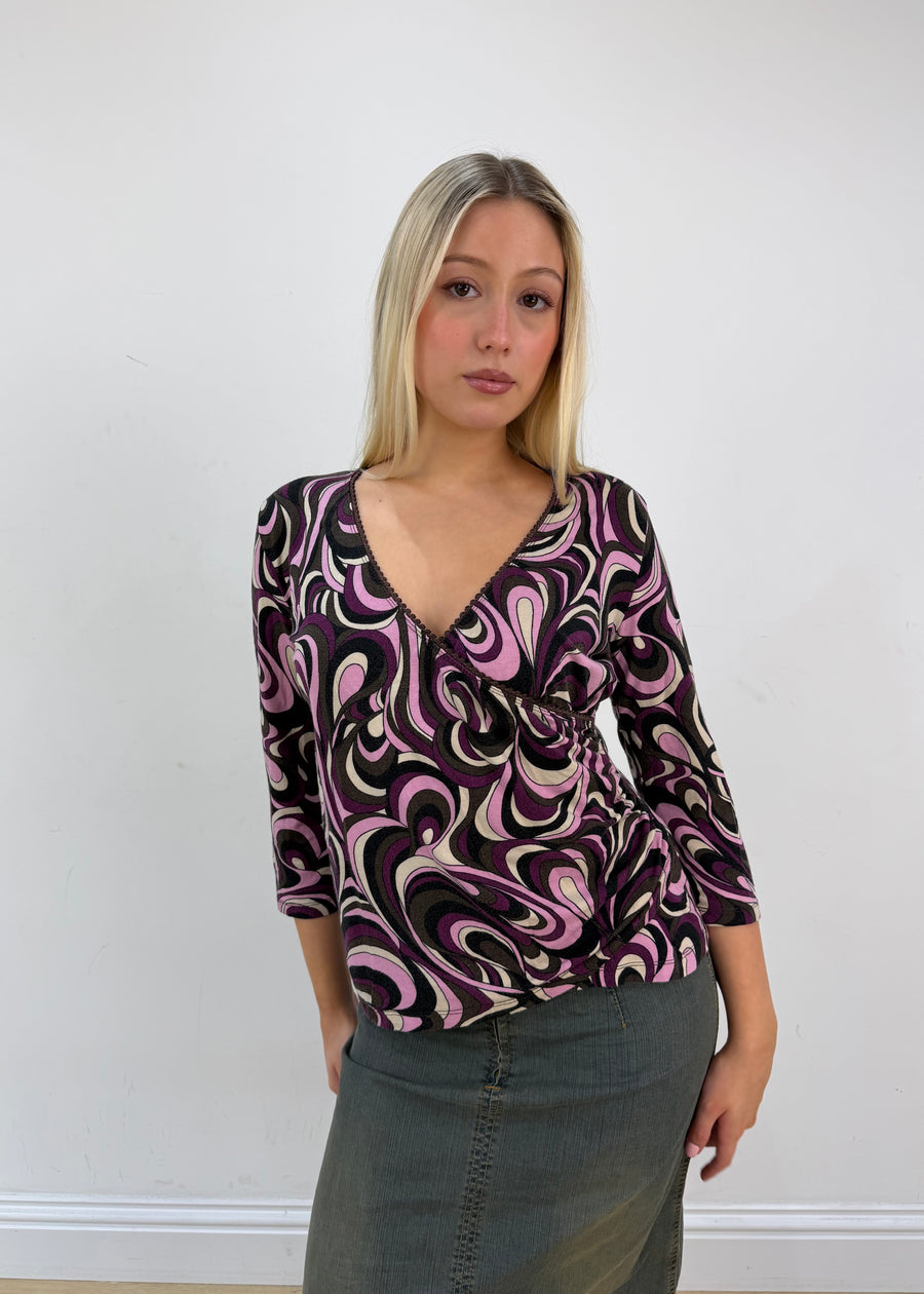 large purple black and white swirl print top front zoom with face
