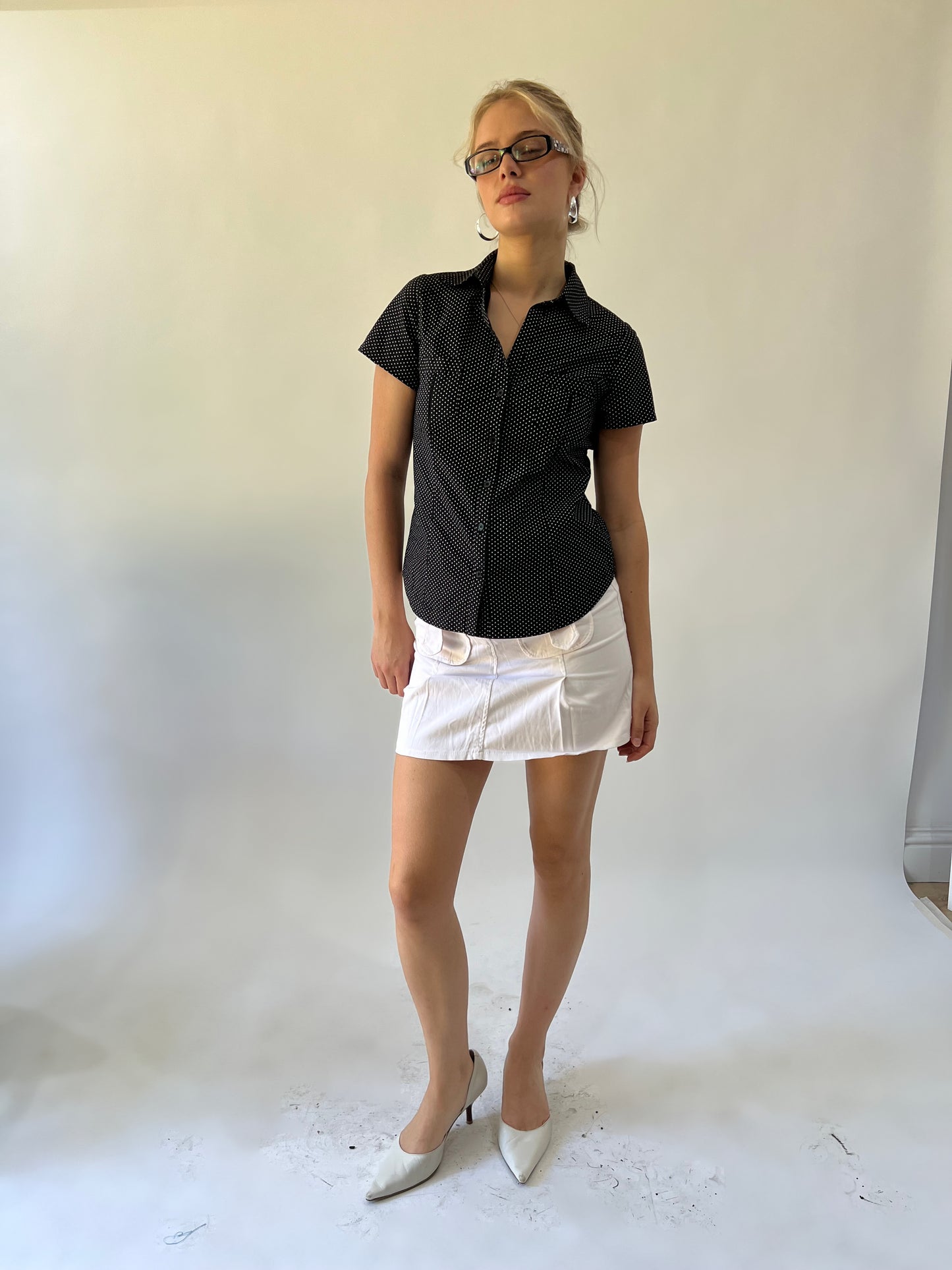 small black and white polka dot short sleeve shirt front view
