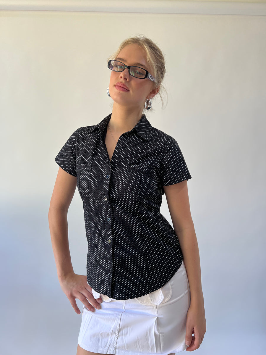 small black and white polka dot short sleeve shirt close front view