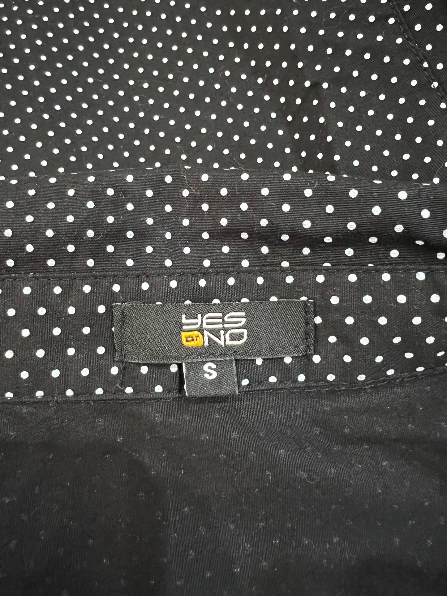 small black and white polka dot short sleeve shirt brand and size label
