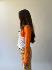 small orange cropped bolero cardigan side view