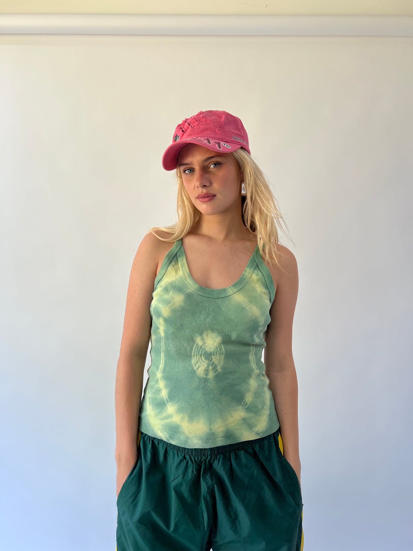 small pink 211 embroidered cap worn front view