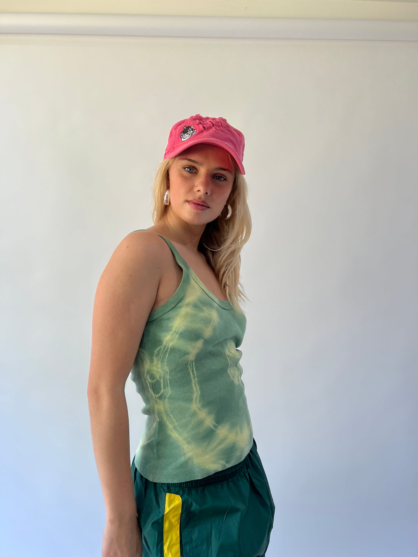 small pink 211 embroidered cap second worn front view