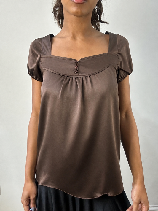 front view of brown satin short sleeve top, freshly steamed