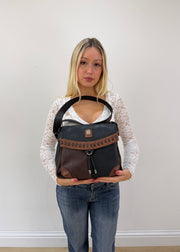 charm and shape black and brown colour block leather bag 2