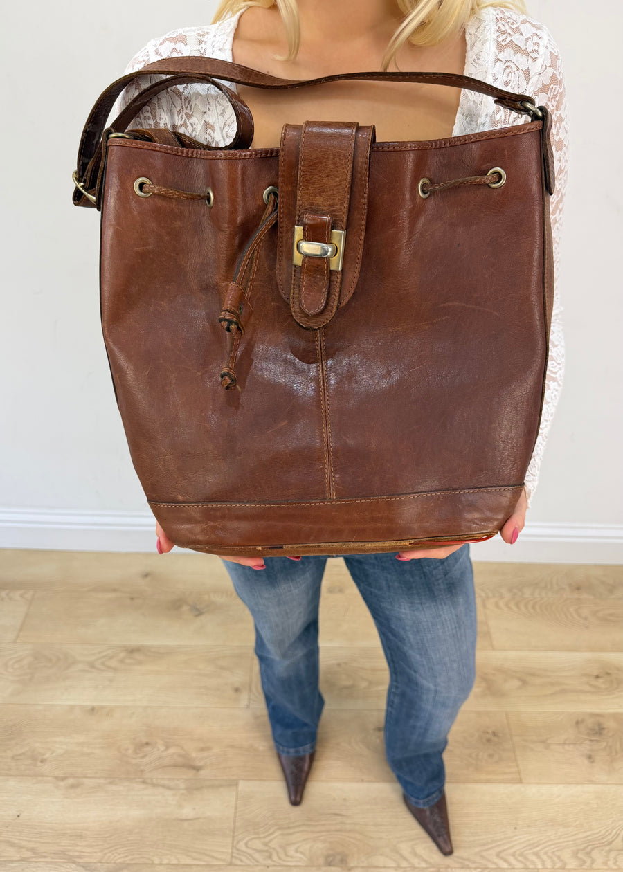 brown leather drawstring shoulder bag with gold buckles 3