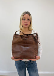 brown leather drawstring shoulder bag with gold buckles 4