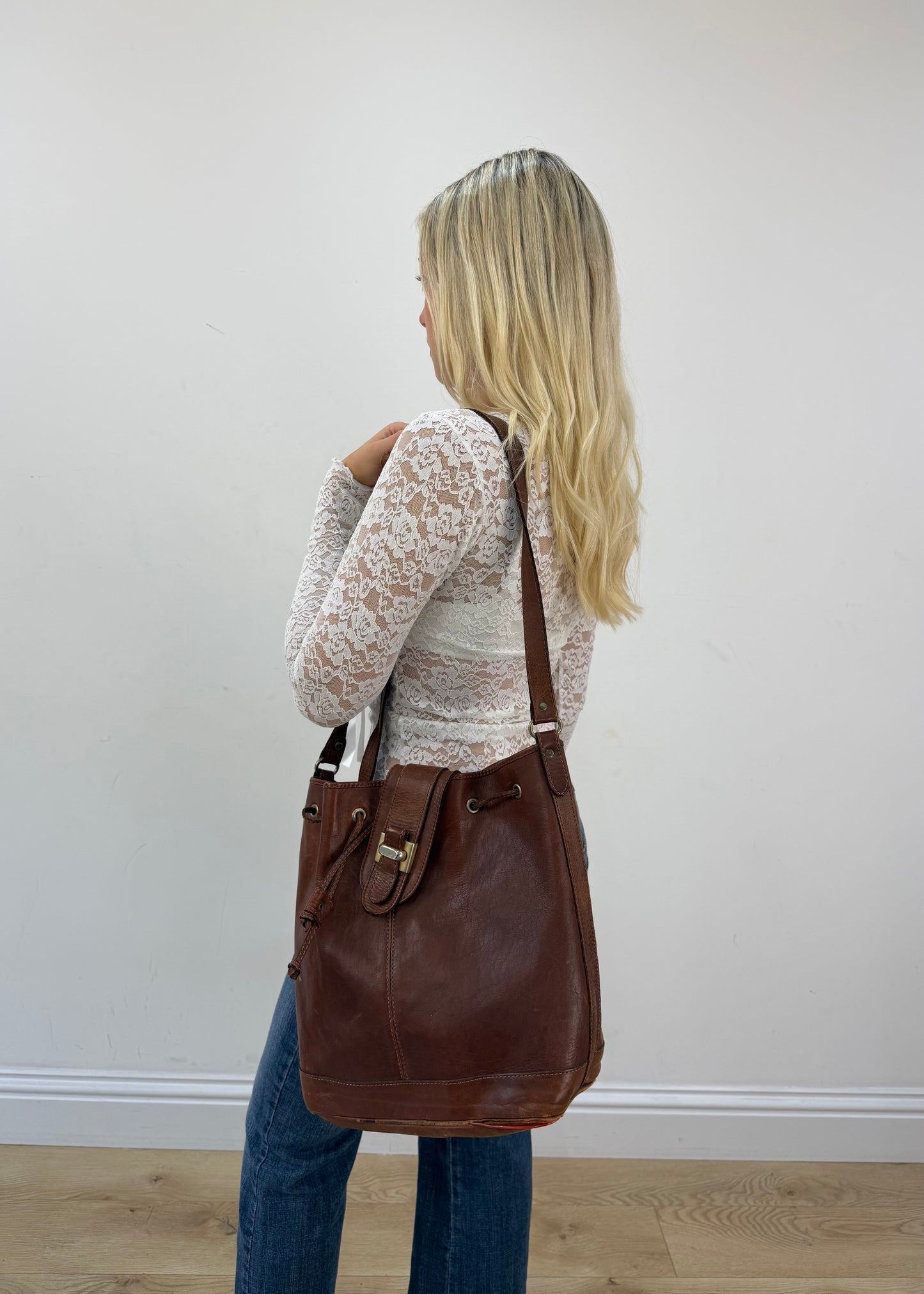brown leather drawstring shoulder bag with gold buckles 5