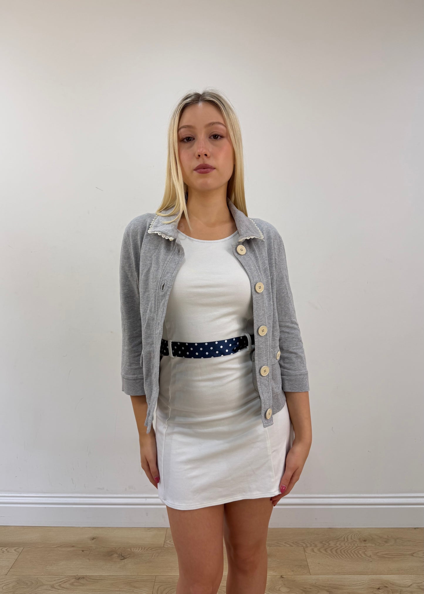 small grey moschino cardigan top posed