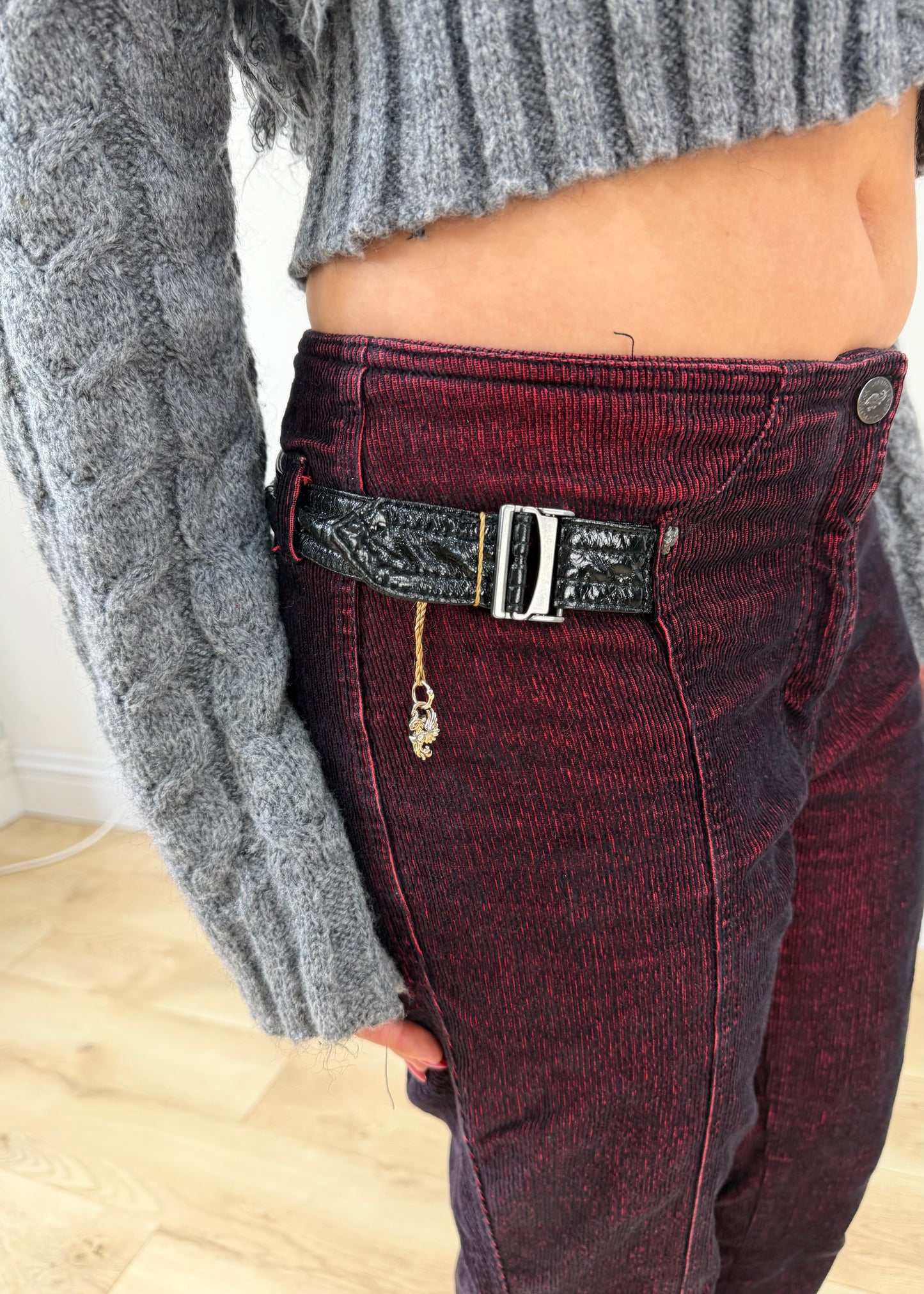 small red and black denim jeans posed