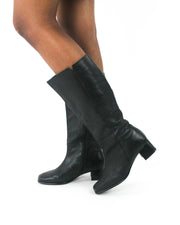detail view of black knee-high block-heel boots - 4:5 crop