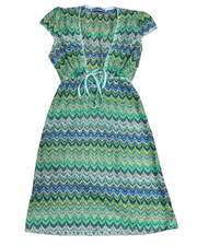 Allegra Dress in Pistachio Green laid flat – front view