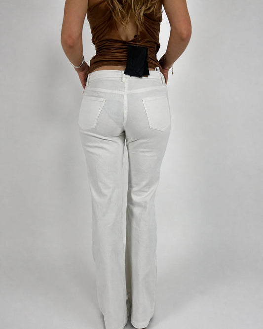 white low-rise flared trousers back view