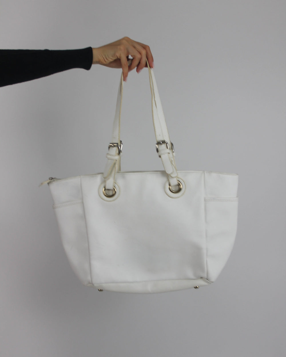 white tote bag with gold-tone hardware back view