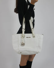 white tote bag with gold-tone hardware detail view 01