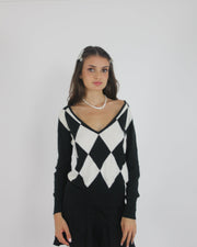 black and white argyle v-neck jumper front view