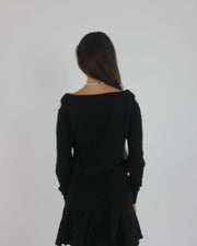 black and white argyle v-neck jumper back view