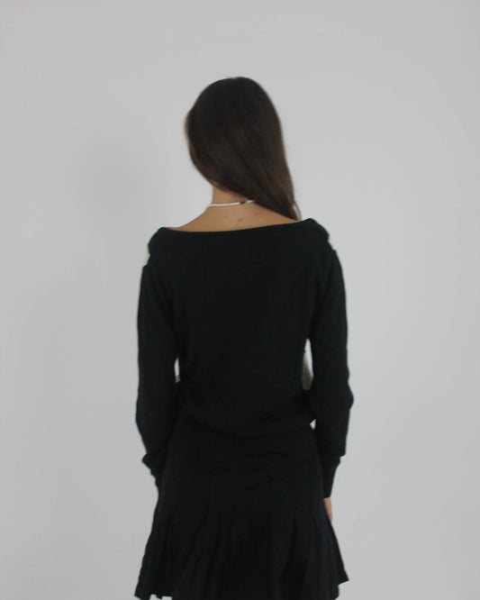 black and white argyle v-neck jumper back view