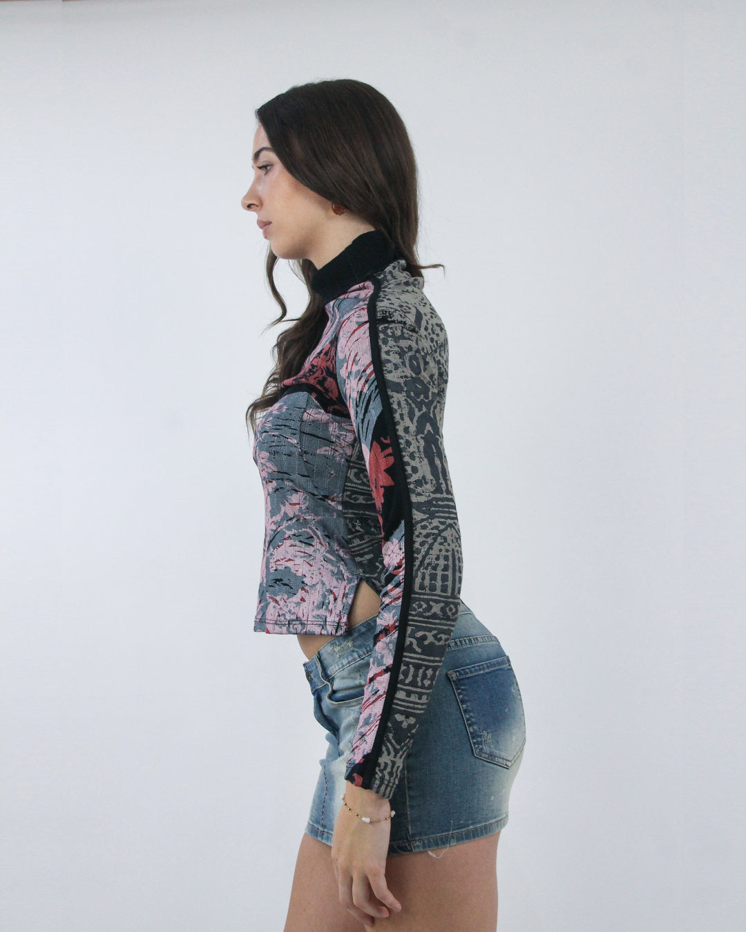 small pink and black abstract print long sleeve top, opposite side view
