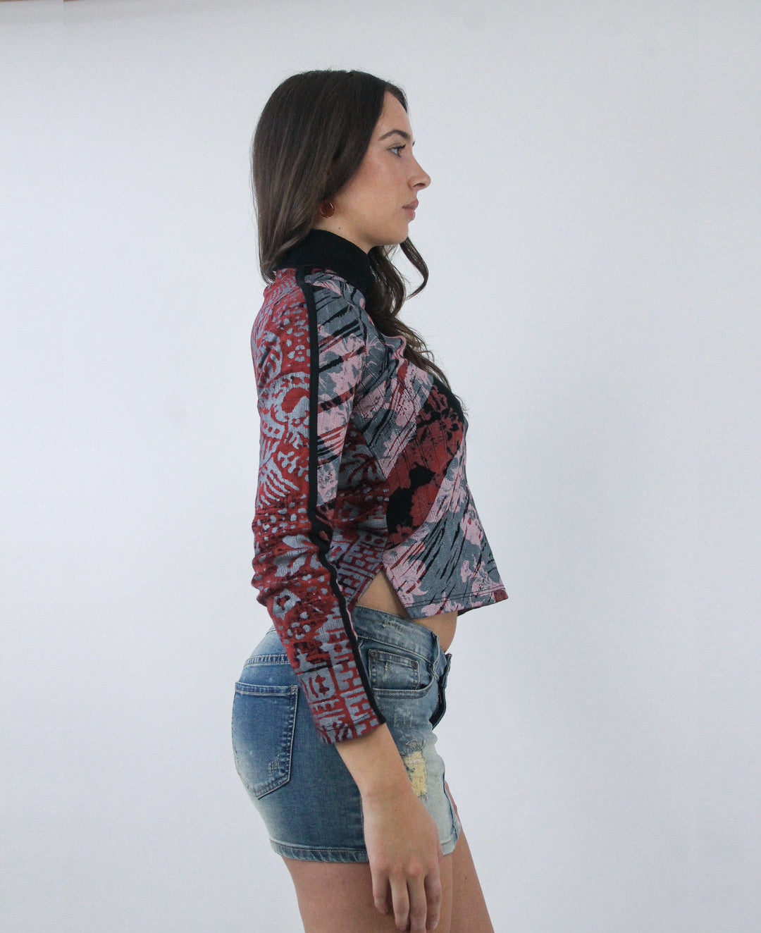 pink and black abstract print long sleeve top, side view