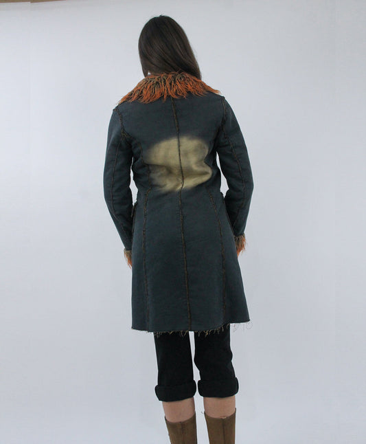 dark green coat with orange faux fur trim, back view