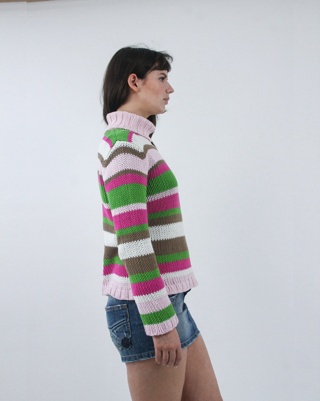 pink and green striped turtleneck jumper, side view