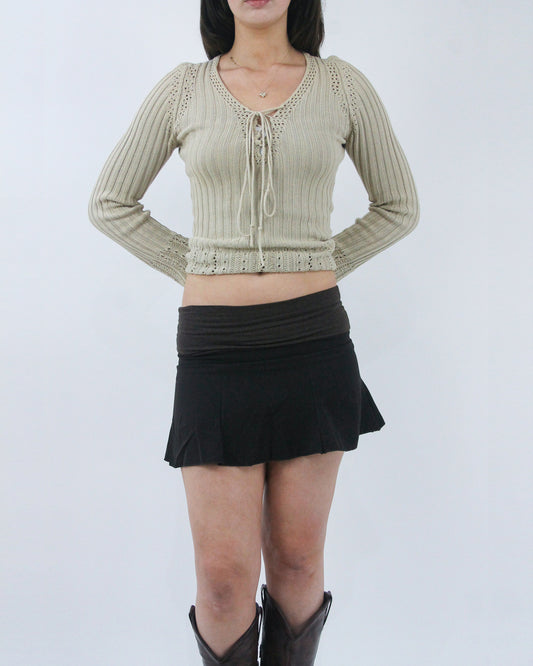 black pleated mini skirt, detail view