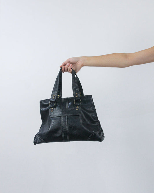 black structured handbag, back view