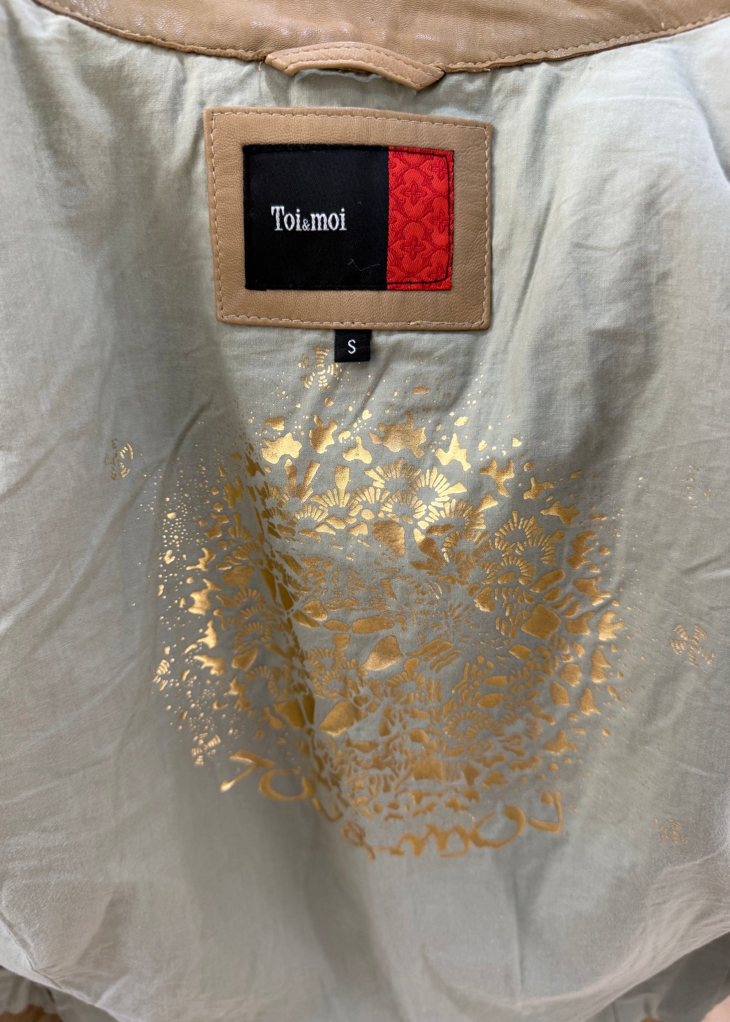 small beige toi and moi fitted utility jacket label