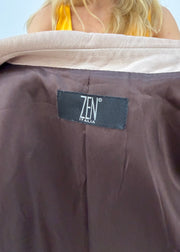 small tan fitted pocket jacket label