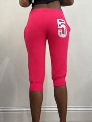 Hot pink cropped joggers, steamed, back view