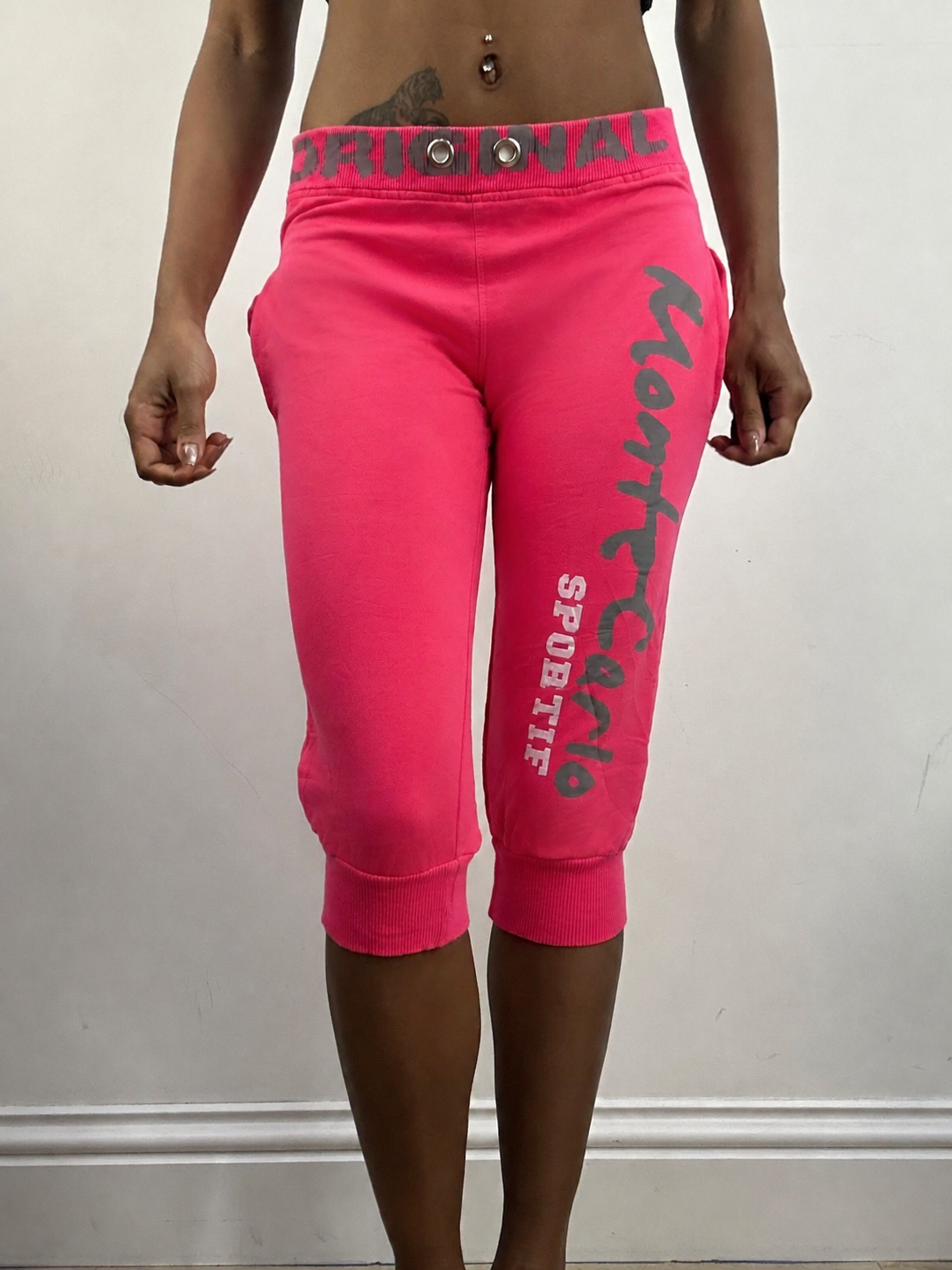 Hot pink cropped joggers, steamed, front view