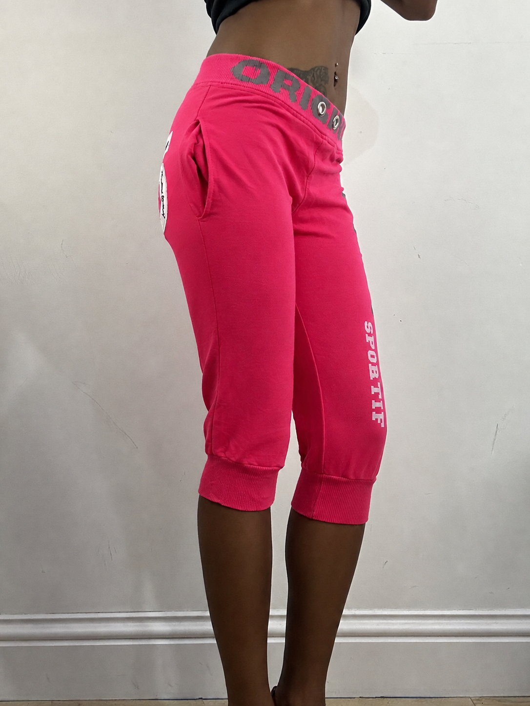 Hot pink cropped joggers, steamed, side view