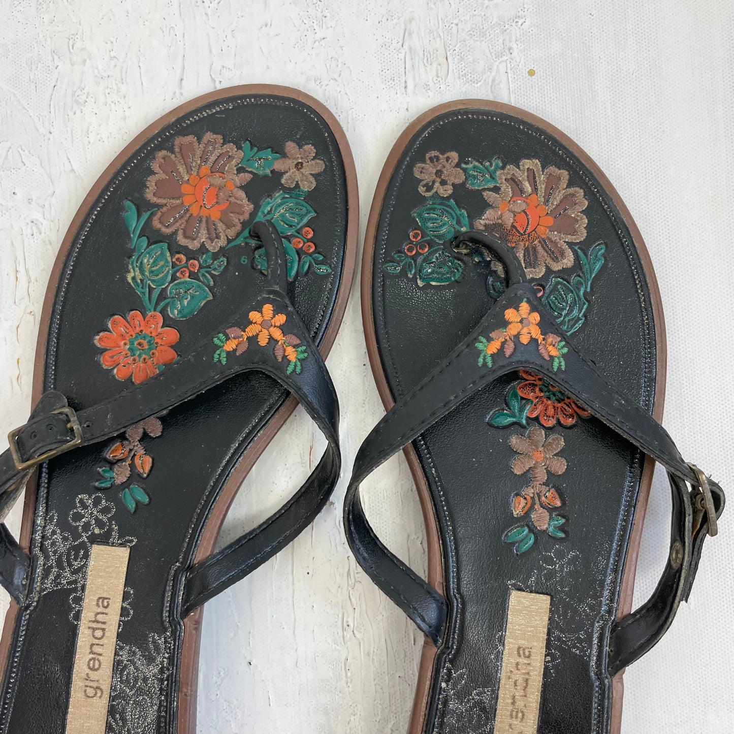 TROPICAL GIRL DROP | size 5 black buckle flip flops with floral multicoloured embroidered details