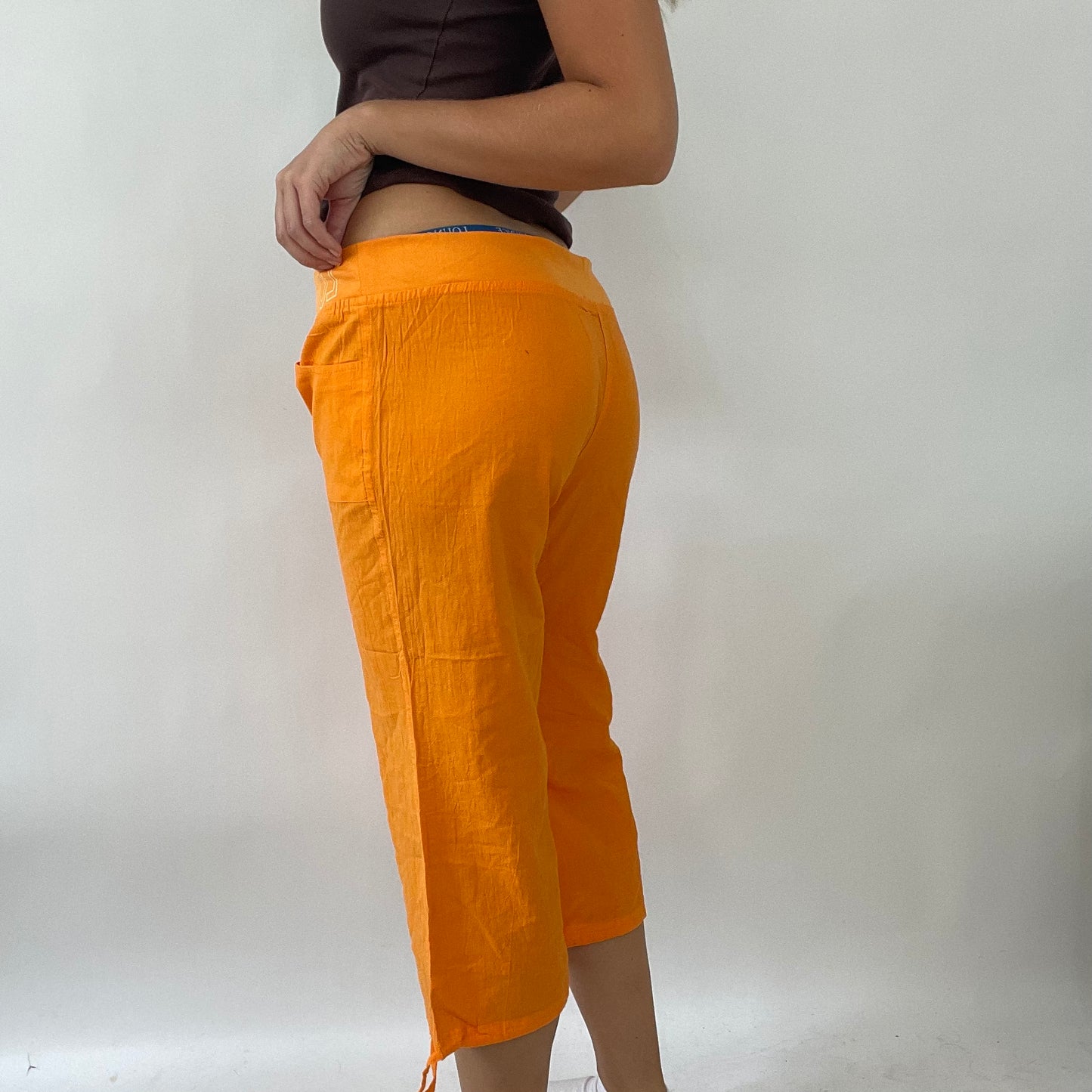 TROPICAL GIRL DROP | orange 3/4 length trousers with graphic print - large
