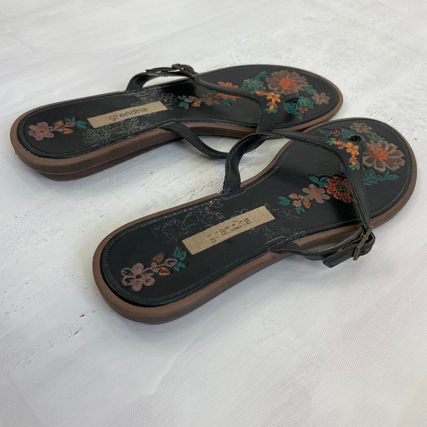 TROPICAL GIRL DROP | size 5 black buckle flip flops with floral multicoloured embroidered details