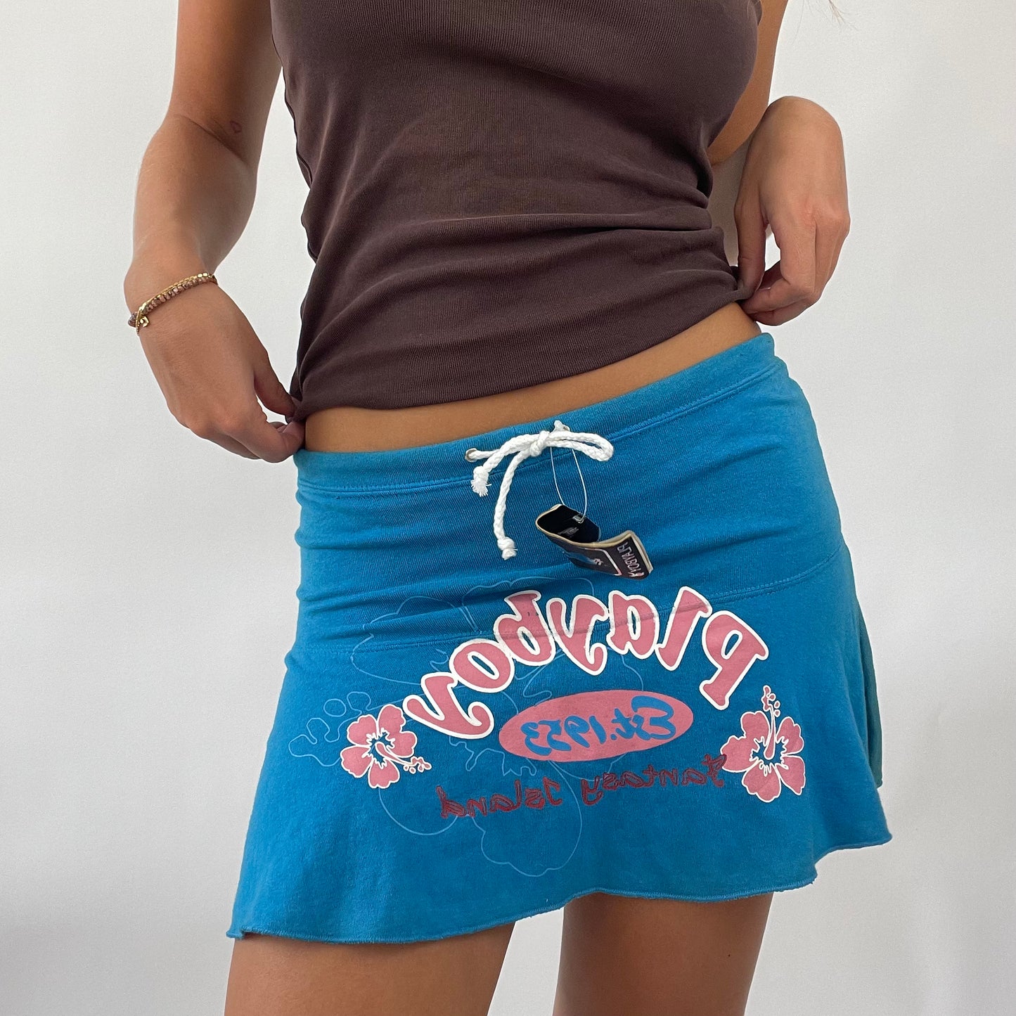 TROPICAL GIRL DROP | blue playboy mini skirt with pink hibiscus graphic - small